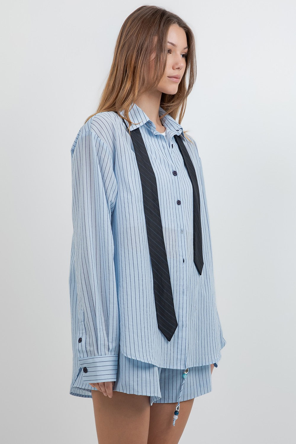 Detachable neck tie shirt and short set.
