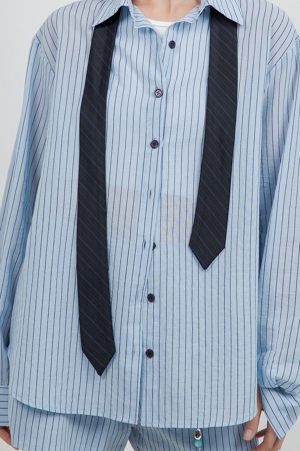 Detachable neck tie shirt and short set.
