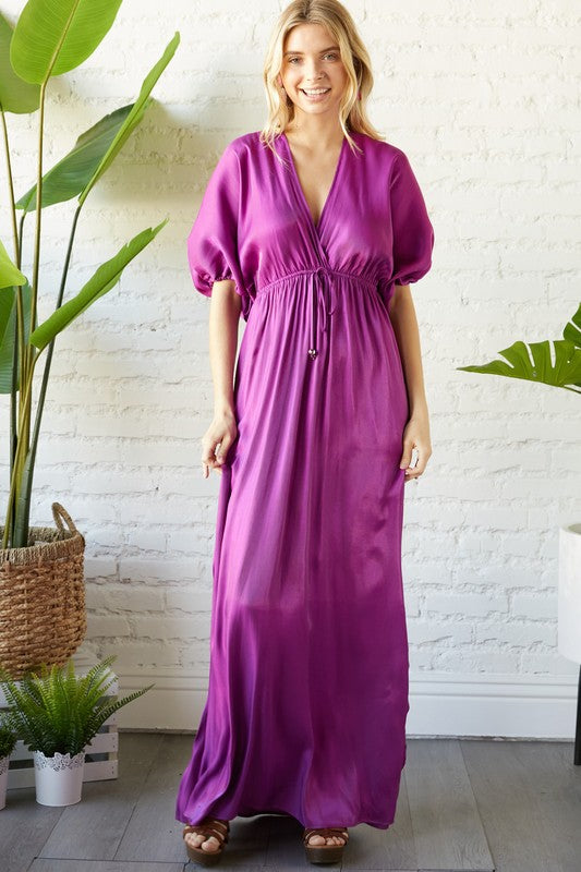 Loose dress with fitted waist.